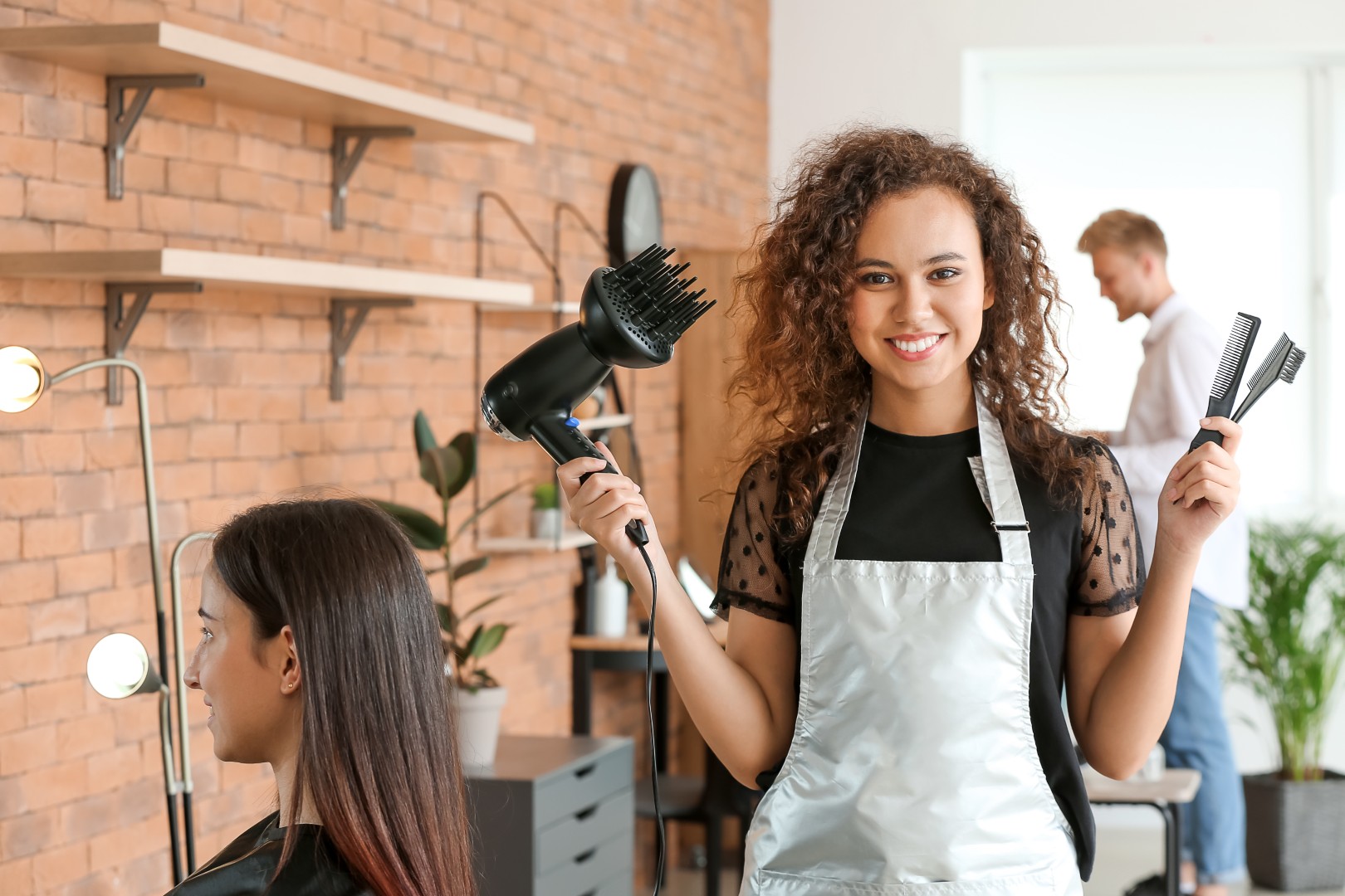 Hairdresser with hairdressing tools