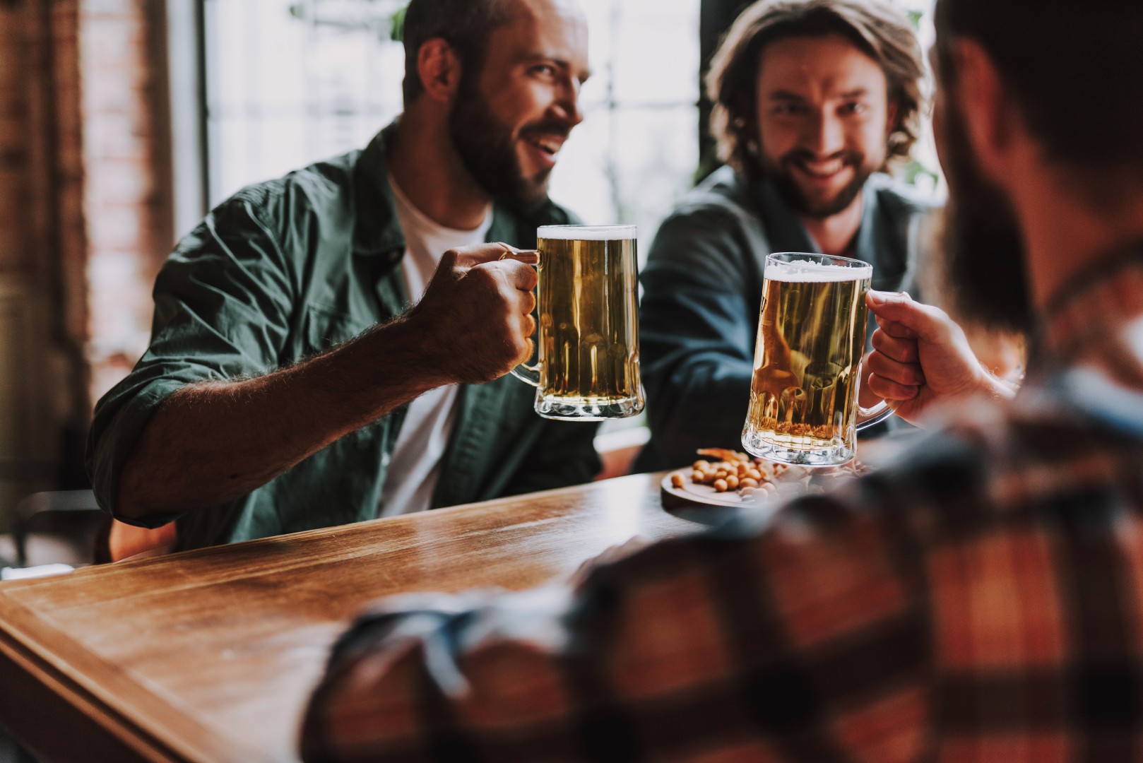 friends drinking in pub