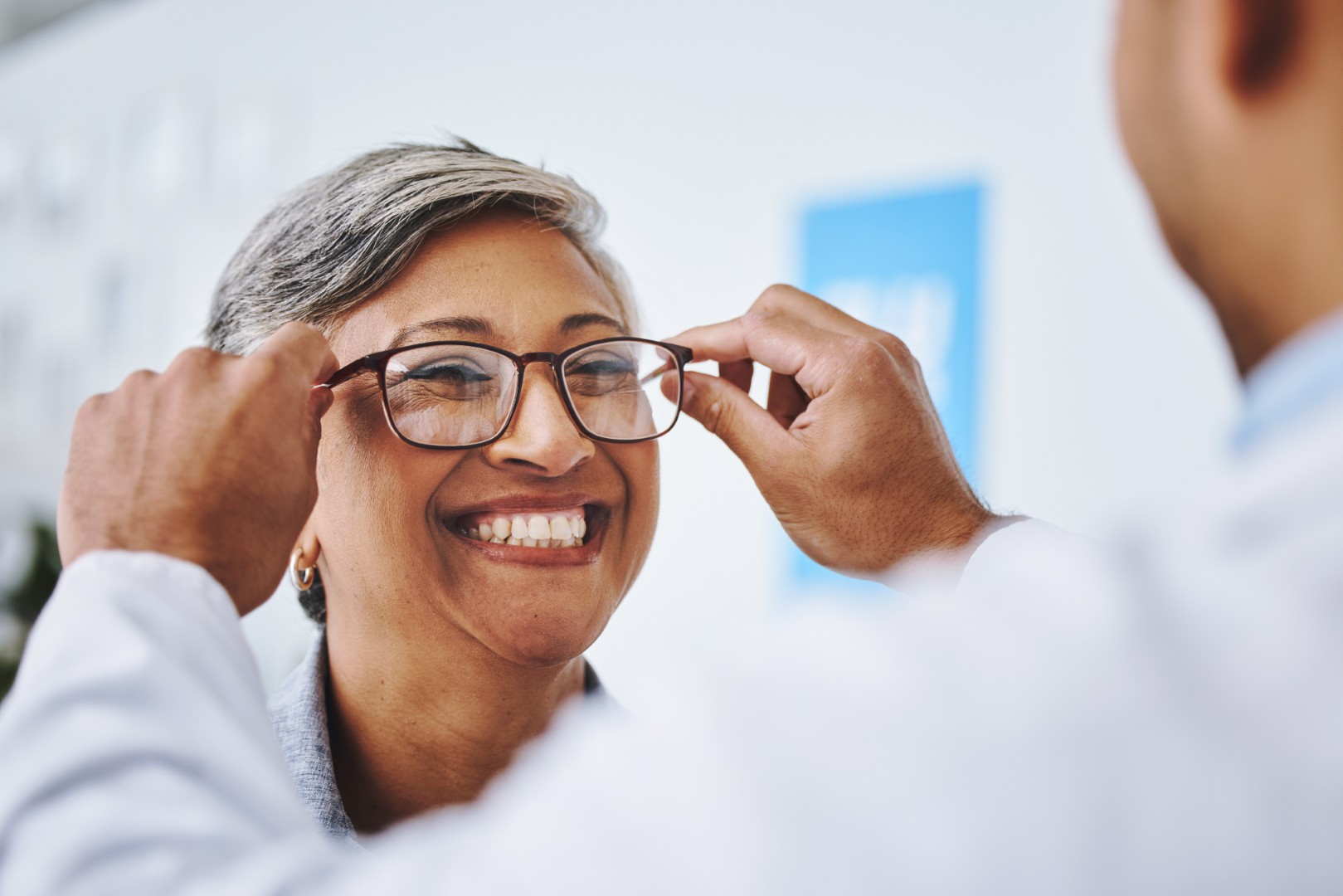 Optometry, smile and woman with prescription glasses