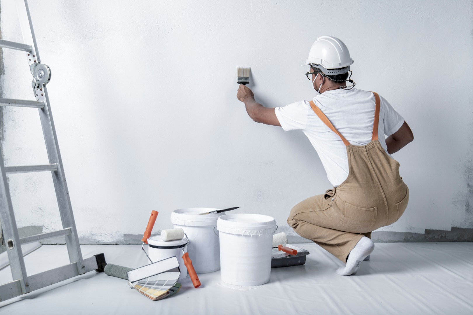 Man painting house